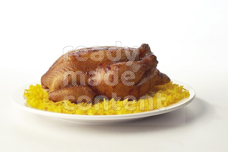 yellow  basmati Rice with  whole roasted chicken on a white rounded plate direct on white background