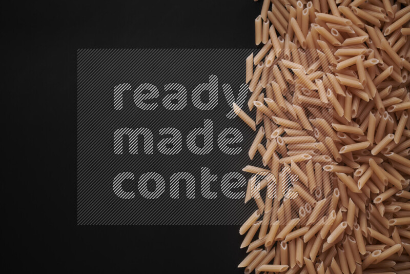 Different pasta types on black background