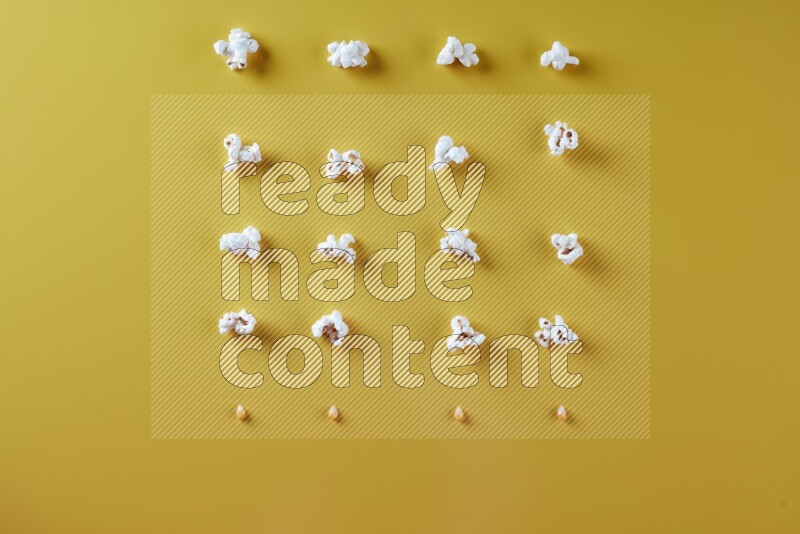 Popcorn flakes and seeds on a yellow background in different angles