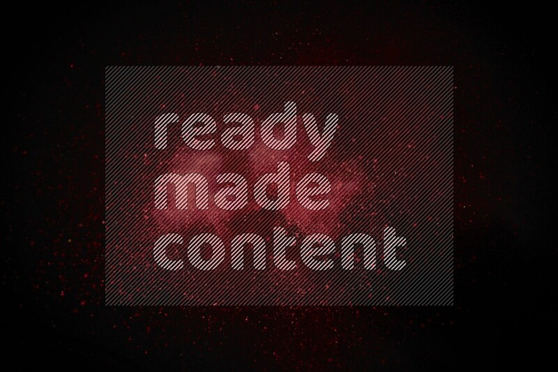 Red powder explosion on black background