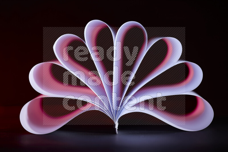 An abstract art piece displaying smooth curves in pink and purple gradients created by colored light