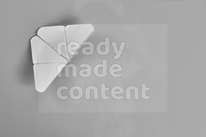 Origami butterfly on grey background