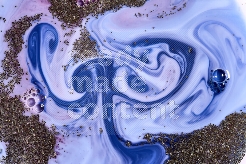 لقطة مقربة لبريق ذهبي متلألئ منتشر على خلفية من اللون الأزرق والأحمر في حركات دائرية