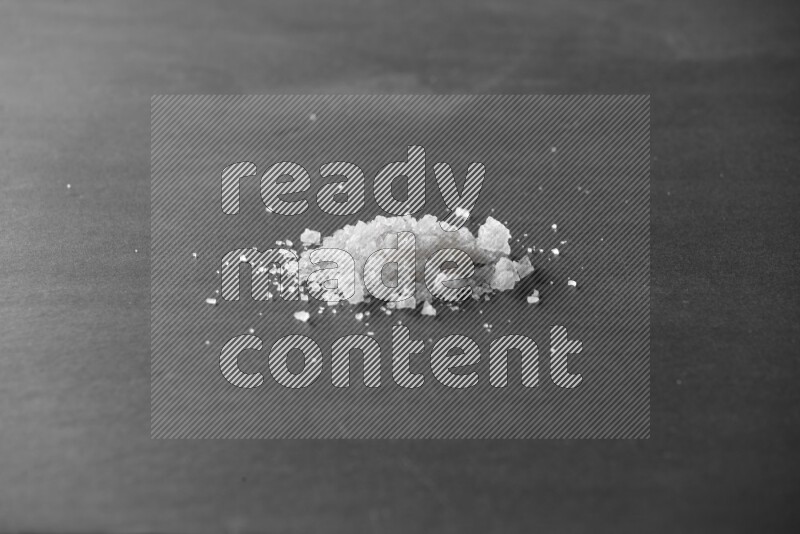 Salt on a black flooring
