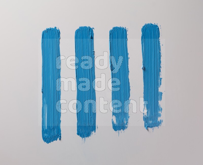 Multi blue straight brush strokes in different shapes on a white background
