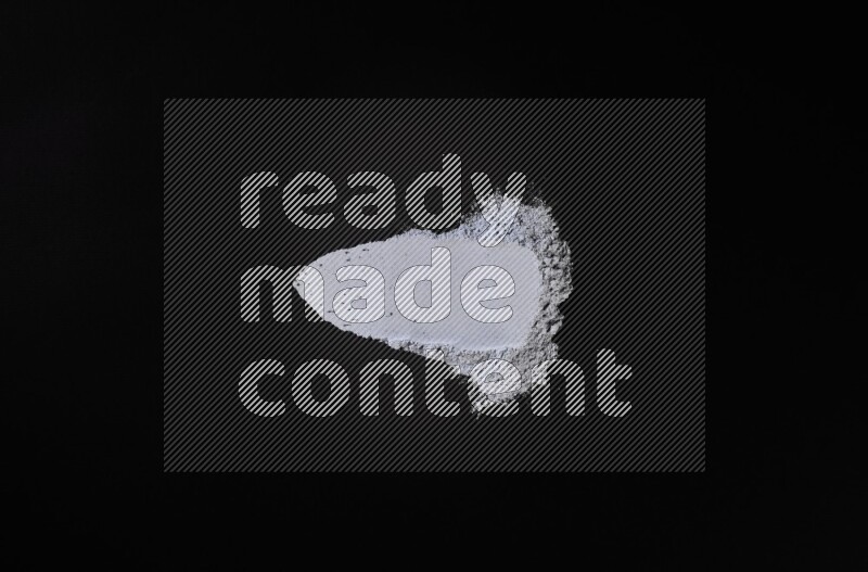 Blue powder strokes on black background