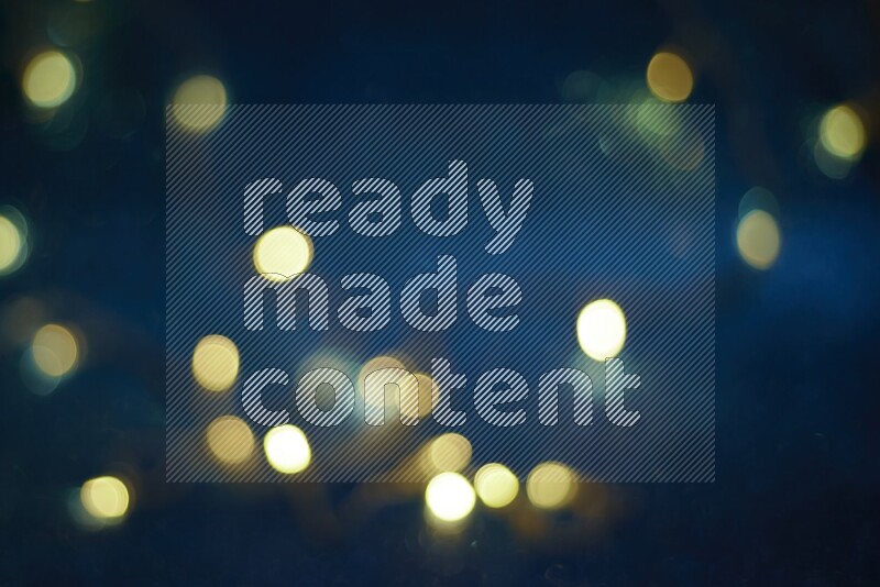 Bokeh light in yellow with blue background