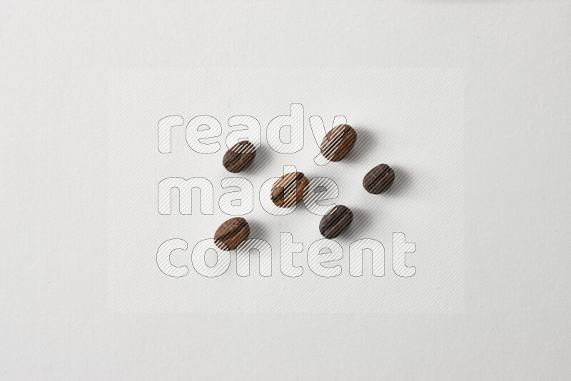 Roasted coffee beans on white background