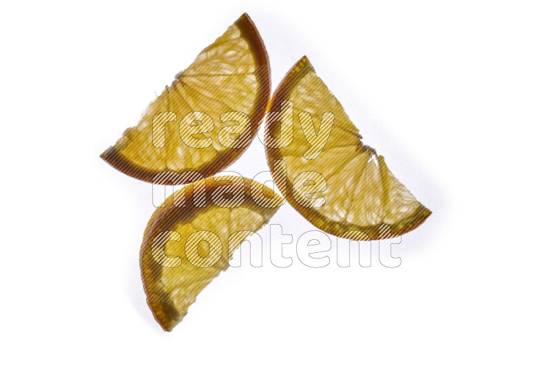 Orange slices on illuminated white background