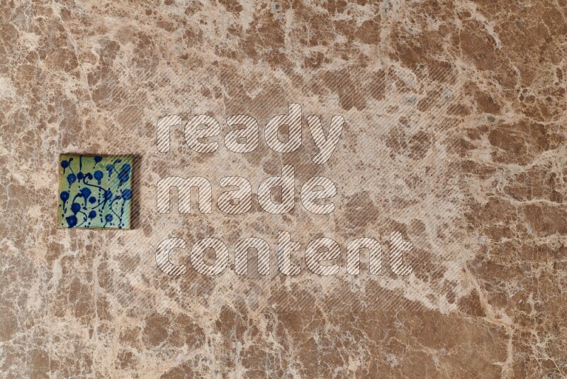 A decorative coaster on beige marble background