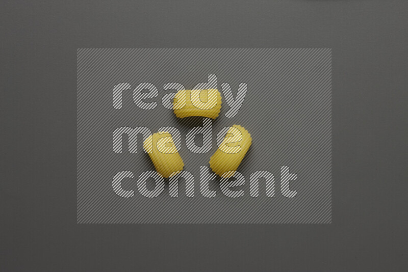 Elbow pasta on grey background