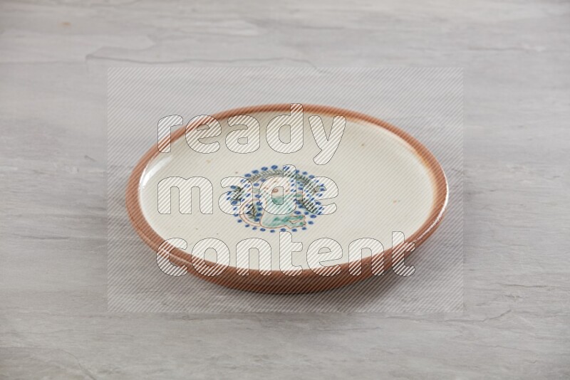 multi color ceramic round plate on grey textured countertop