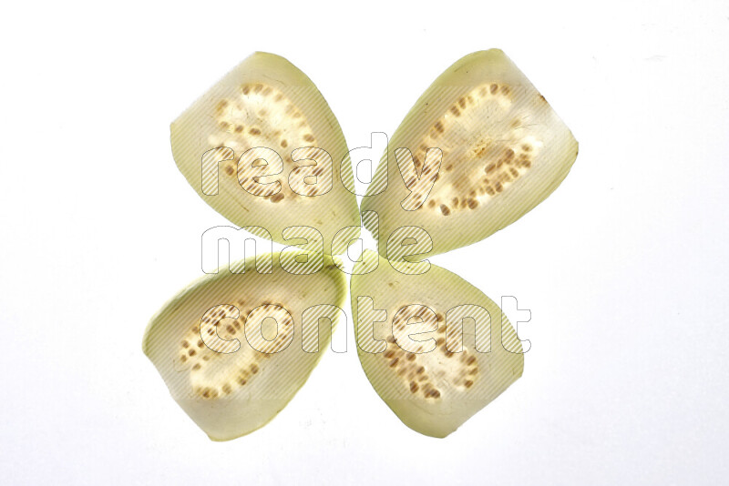 Guava slices on illuminated white background