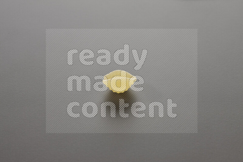 Shells pasta on grey background