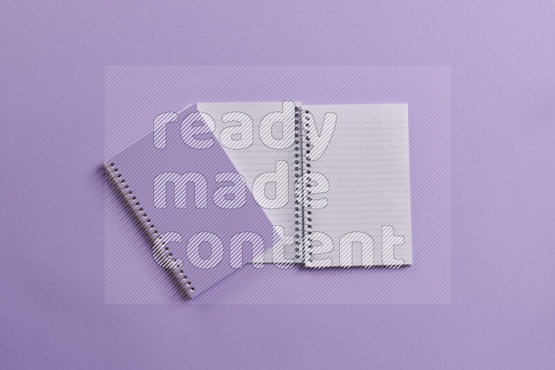 A purple notebook on purple background