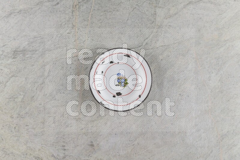 A vintage metal plate on grey marble background