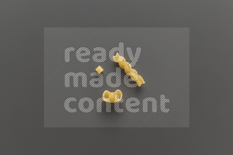 Different pasta types on grey background
