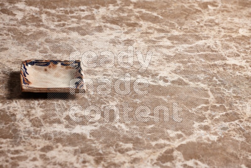 Decorative Pottery Plate on Beige Marble Flooring
