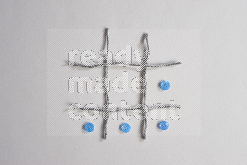 Blue buttons placed on grey background