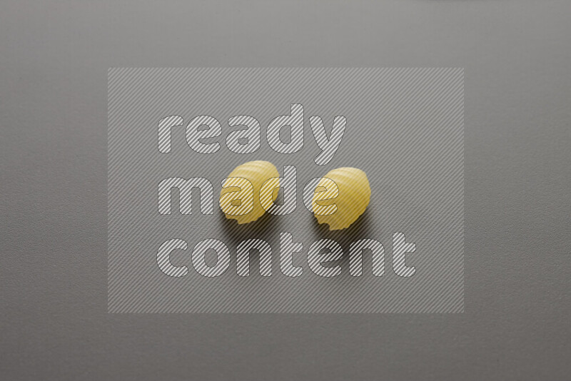 Shells pasta on grey background