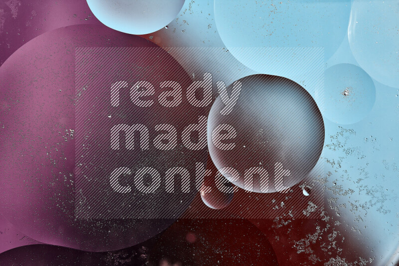 Close-ups of abstract oil bubbles on water surface in shades of blue, orange and purple