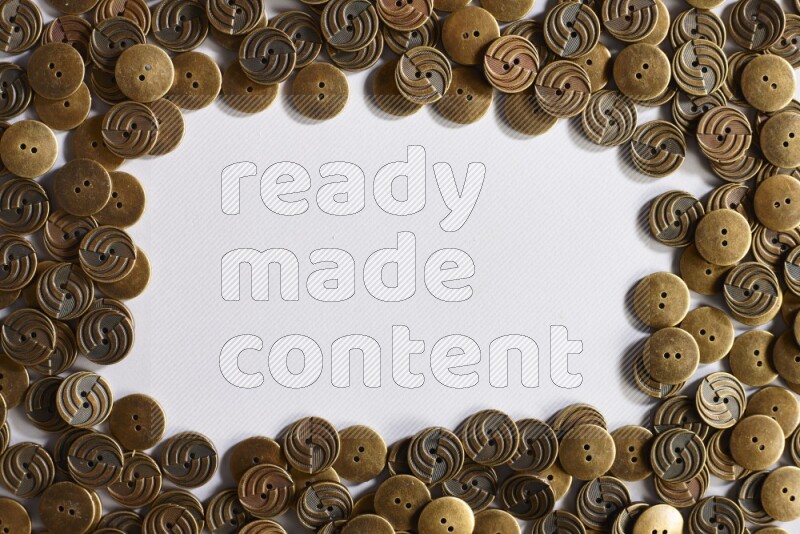 Metal buttons placed on grey background