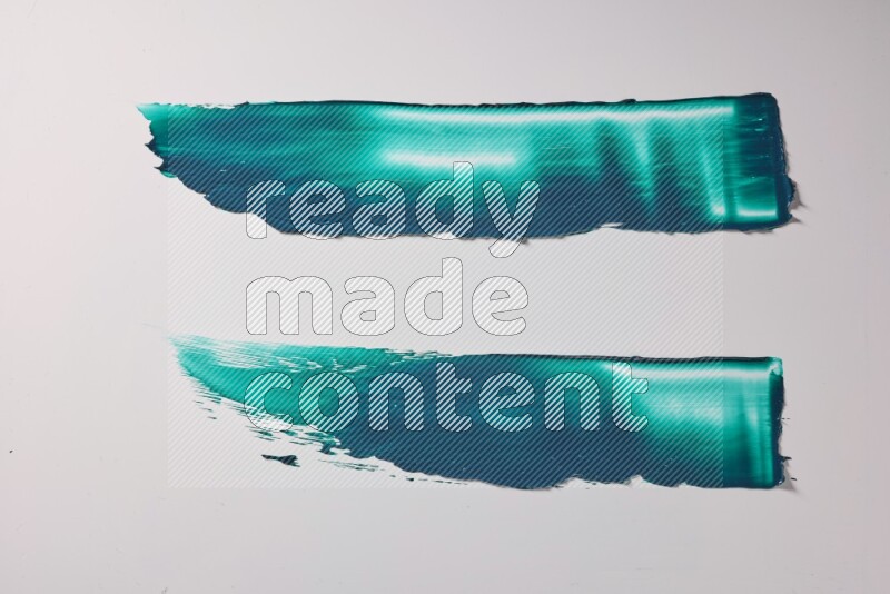 Turquoise painting knife strokes on white background