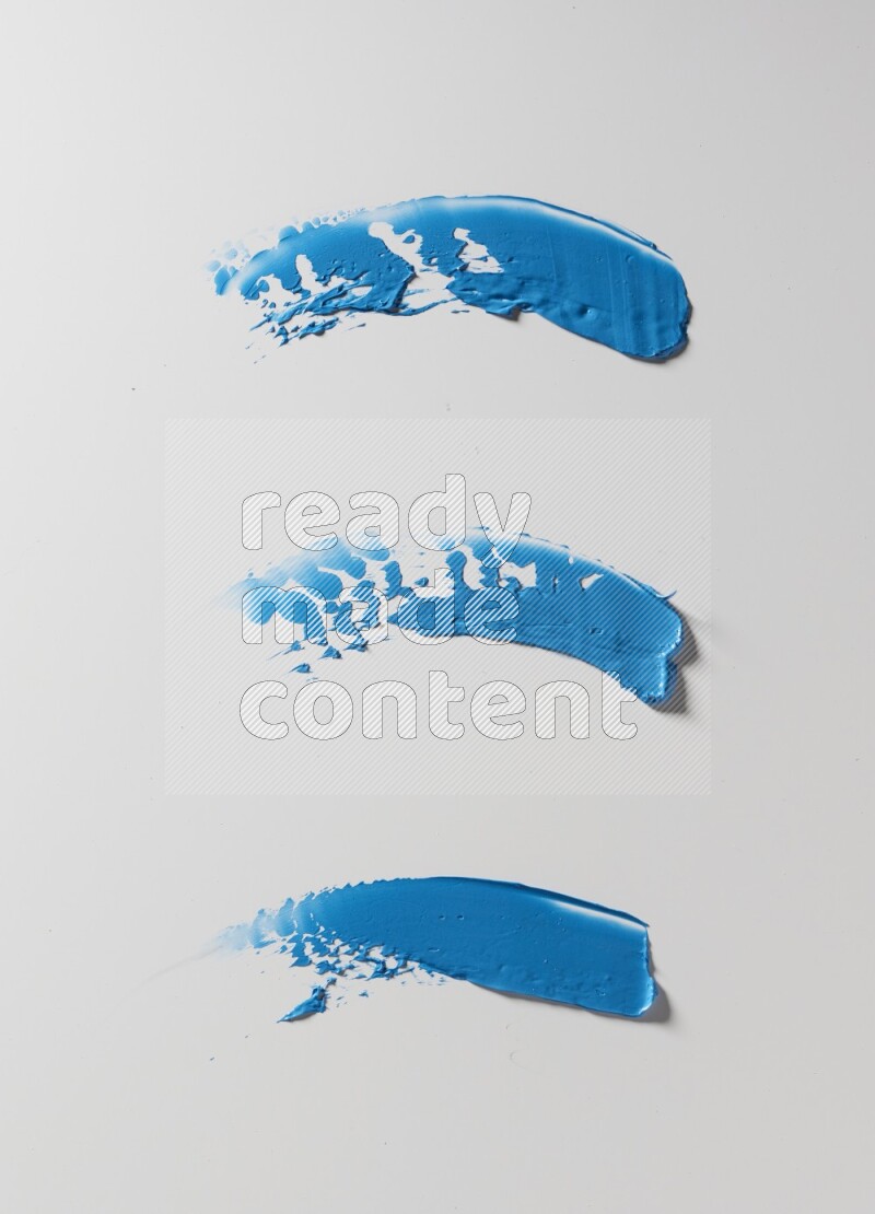 Blue painting knife strokes on white background