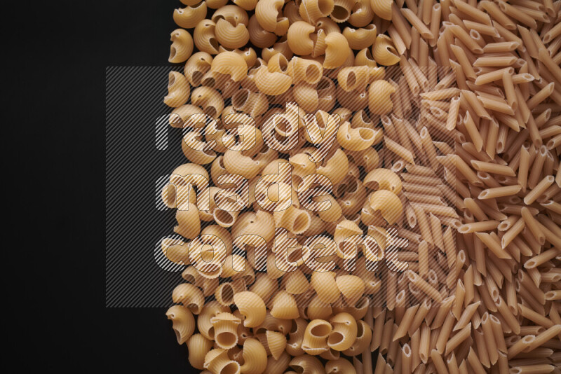 Different pasta types on black background