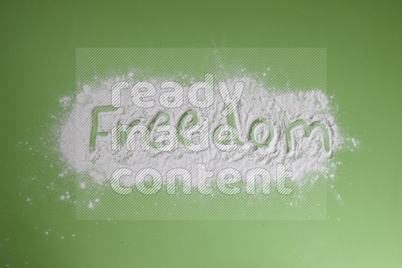 A word written with powder on green background