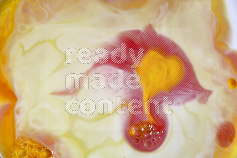 A close-up of abstract swirling patterns in orange, red and white