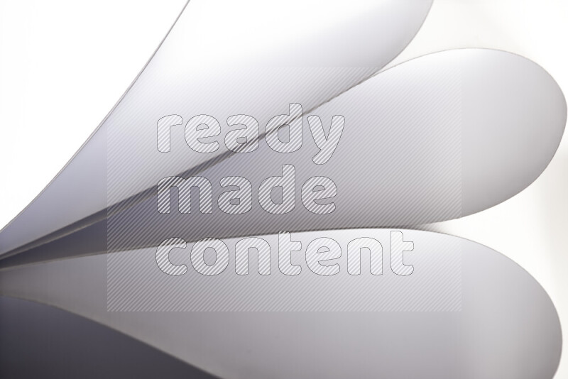 An abstract art showing grey paper sheets arranged in an overlapping curves