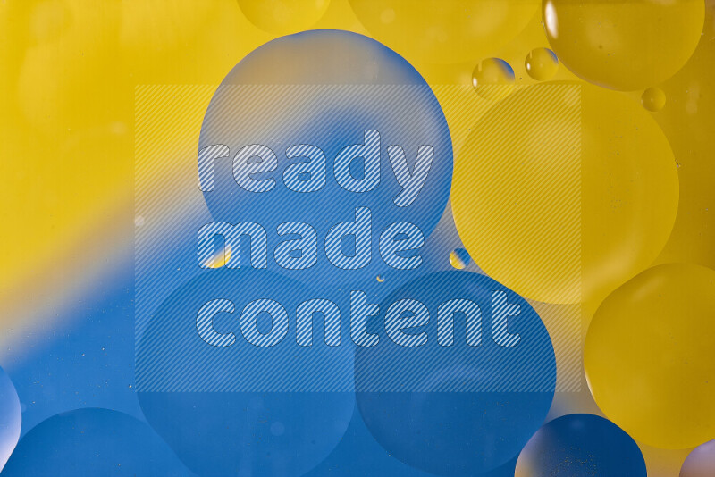 Close-ups of abstract oil bubbles on water surface in shades of blue and yellow