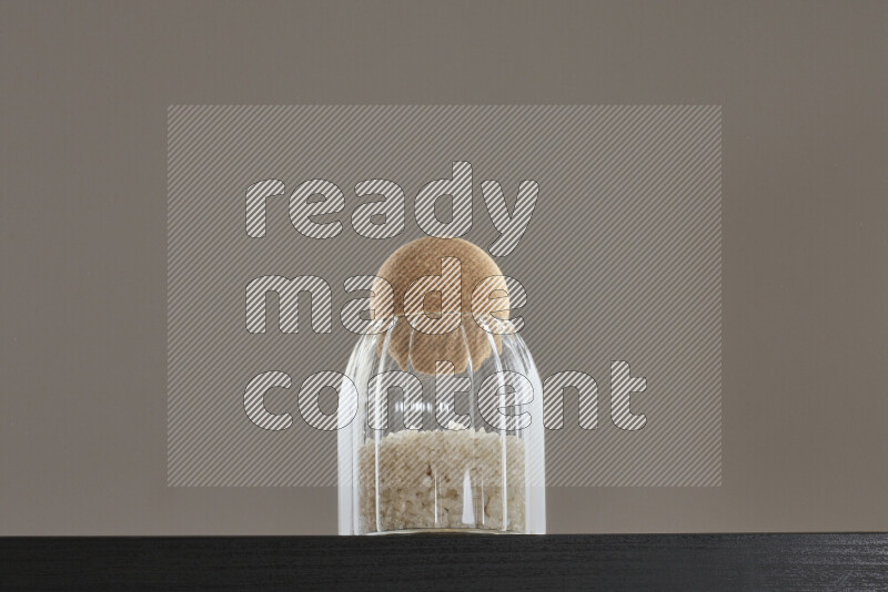 Salt in a glass jar on black background