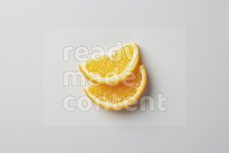 Two halves of an orange slices on white background