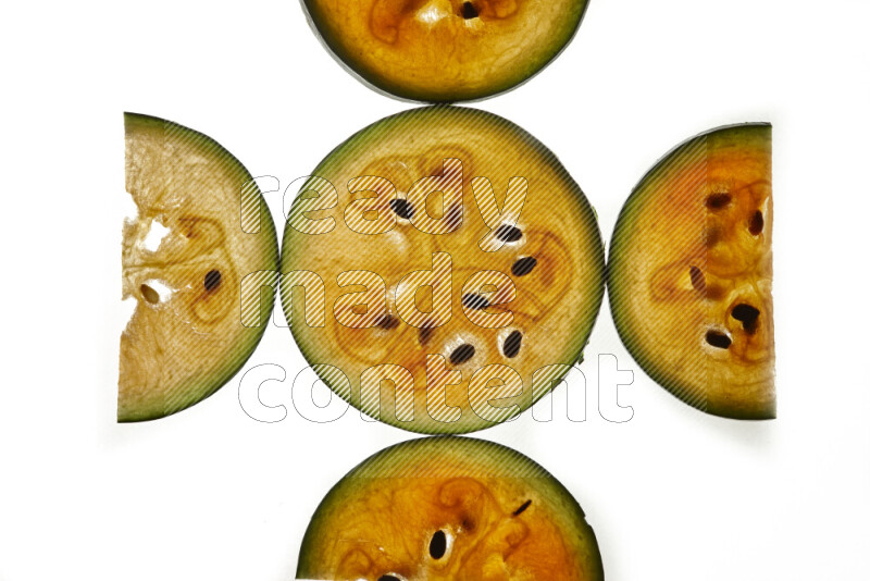 Watermelon slices on illuminated white background
