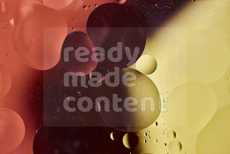 Close-ups of abstract oil bubbles on water surface in shades of red and yellow