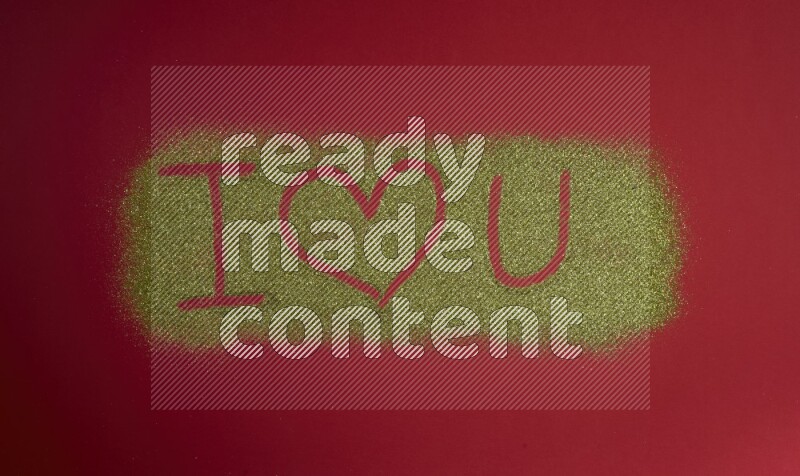 A sentence written with gold glitter on red background