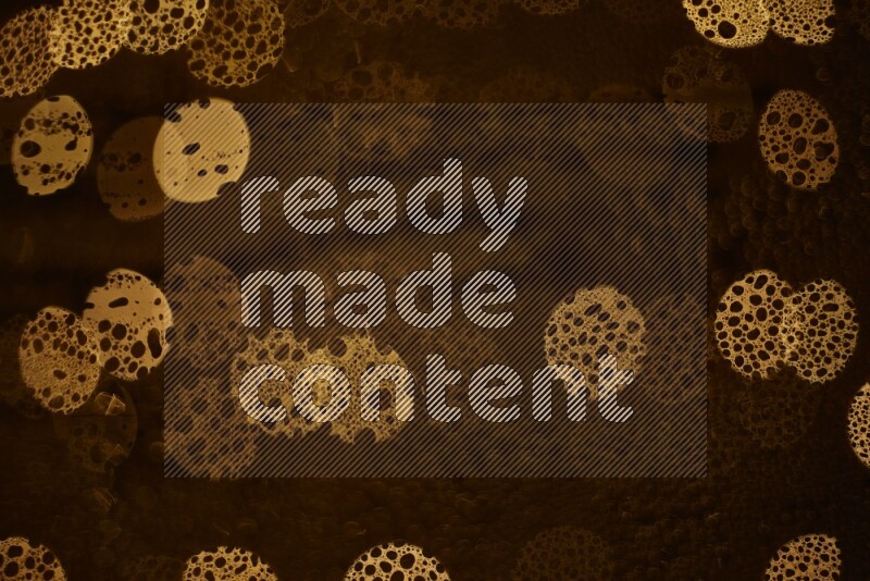 Bokeh light in yellow with water drops