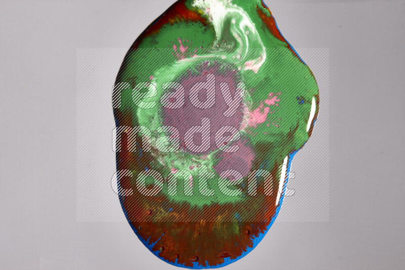 Close-ups of assorted colors blending on a grey background