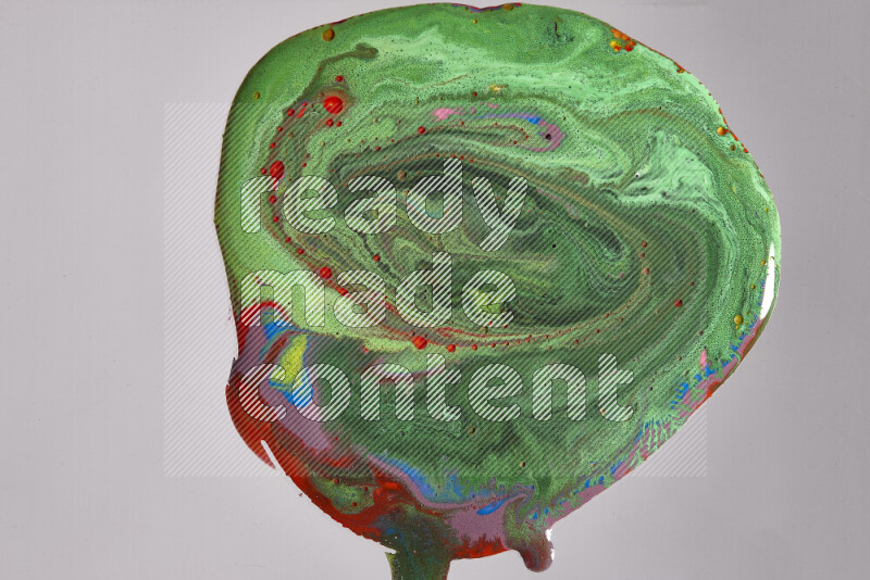 Close-ups of assorted colors blending on a grey background