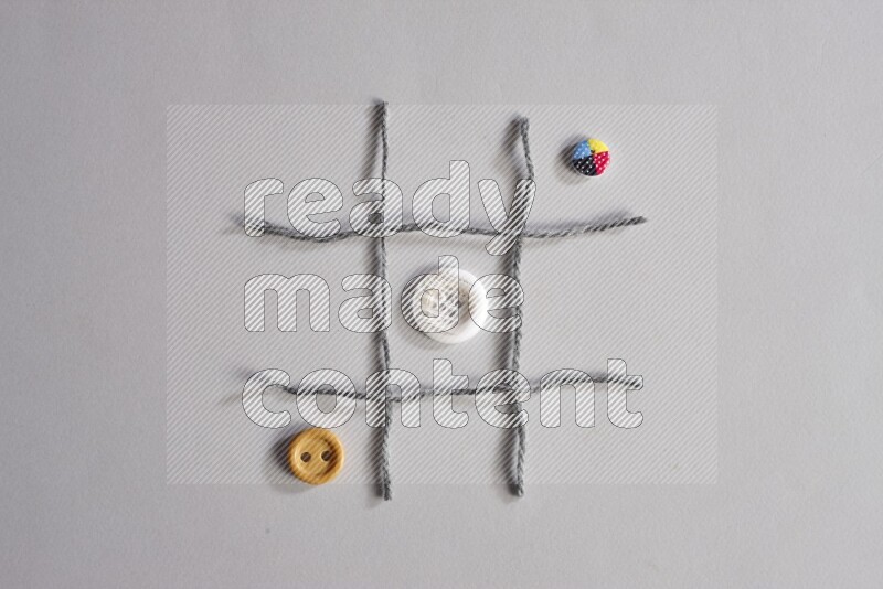 Multicolored buttons placed on grey background