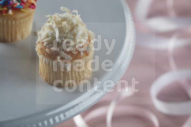 Vanilla mini cupcake topped with coconut