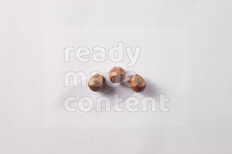 Hazelnuts on white background