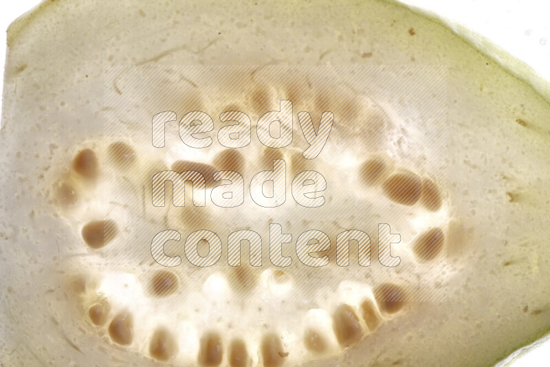 Guava slices on illuminated white background