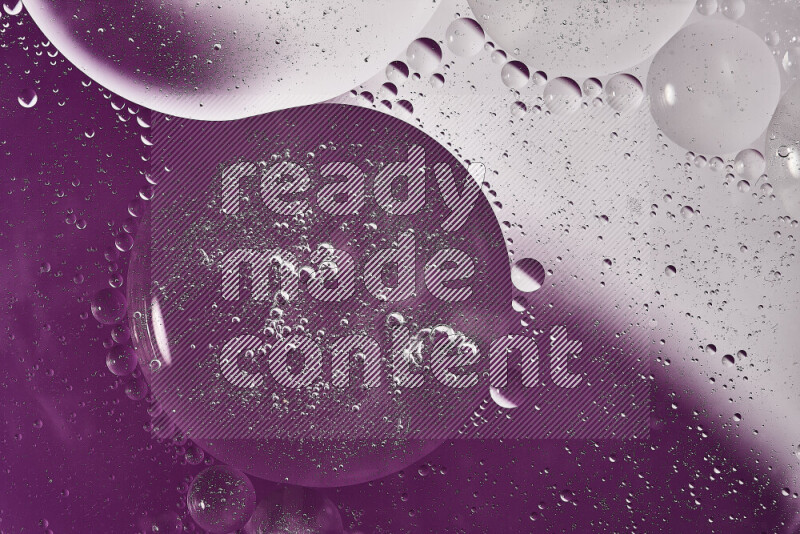 Close-ups of abstract oil bubbles on water surface in shades of white and purple