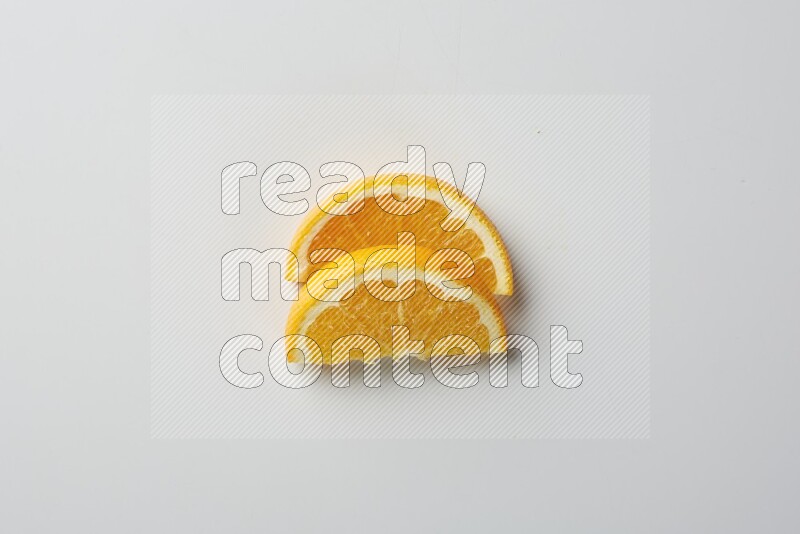 Two halves of an orange slices on white background