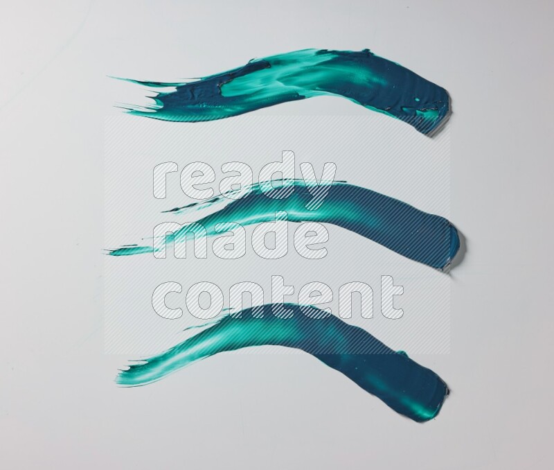 Turquoise painting knife strokes on white background