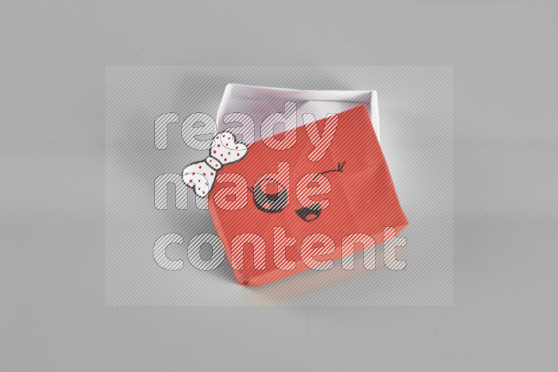 Origami gift box on grey background