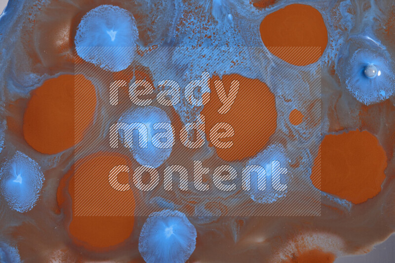 Abstract colorful background with mixed of orange and blue paint colors